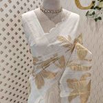 Linen saree with large floral motifs and flowing leafs on the body
