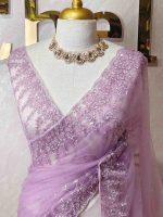 Net saree with a combination of floral sequin motifs and delicate beadwork, often with a decorative scalloped border - Image 8