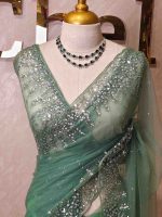 Net saree with a combination of floral sequin motifs and delicate beadwork, often with a decorative scalloped border - Image 11