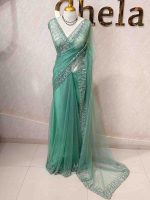 Net saree with a combination of floral sequin motifs and delicate beadwork, often with a decorative scalloped border - Image 12