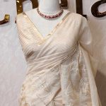 Tissue saree with simple vertical leafs and flower works on the boarder