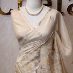 Tissue saree with prominent detailed floral motifs running vertically