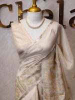 Tissue saree with prominent detailed floral motifs running vertically