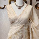 Tissue saree with scattered flowers and its branches motifs on the boarder