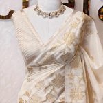 Tissue saree with elegant small flower motifs on the boarder of the saree