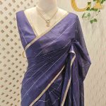 Tisse saree with stripes on the body along with sequins work