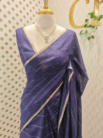 Tisse saree with stripes on the body along with sequins work