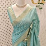 Tissue saree with small square motifs on the body and with simple side boarder