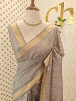 Tissue saree with golden woven motifs scattered on the body and with simple side boarder