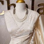 Tussar silk  with  subtle thread work on the boarder along with cutwork scalloped side boarder