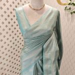Banarasi with floral motifs inside the round like pattern along with slash like lines on the boarder