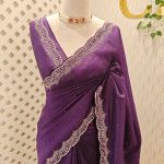 Crushed silk with scalloped cut-work border embellished with intricate silver stone work or sequins.