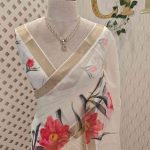 Kerala saree with detailed prints of blooming lotuses with dark  leaves and stems