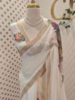 Kerala saree with thick large contrast flowers and  on the pallu and prints on body