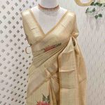Kerala saree with dark colour large flower motif on the pallu and body along with simple sequins work on the motif