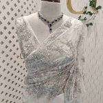 Net saree with thick beads flower and scallop edge finishing