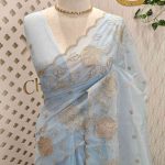 Organsa with flower  motifs all over the body and flowing floral motifs on the boarder portion