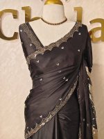 Crepe silk with turkish vertical wavy design on the pallu and embroidery border pattern