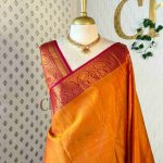 Kanjeevaram with small buttas on the body and paisley design contrast border