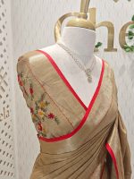 Linen saree with intricate floral motifs in shades of red, yellow, and beige, accompanied by green leaves and decorative horizontal running stitches - Image 9