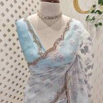 Organza with scattered turkish floral work on the body and scallop border