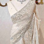 Organza with turkish floral work and sequins spreading on the body and heavy embroidered border