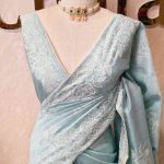 Semi tussar with large floral motifs embroidered in  thread across the body and along a defined border
