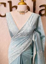 Semi tussar with large floral motifs embroidered in  thread across the body and along a defined border