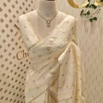 Tissue silk saree with petal like applique work design and buttas scattering