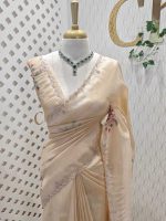 Tissue silk with floral design includes sticky stones and cut beads