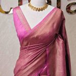 Georgette Banarasi with paisley-inspired zari woven motifs on the body and a traditional zari border
