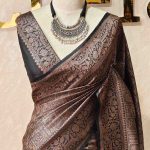 Georgette Banarasi with jacquard-woven floral jaal, and paisley motifs on a check-pattern body,with a traditional zari border