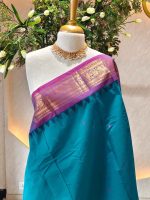 Kanjee cotton with   temple-inspired woven zari border featuring elephant and paisley motifs
