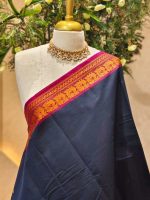 Kanjee cotton with small buttas on the body and contrast zari border with floral geometric woven detailing