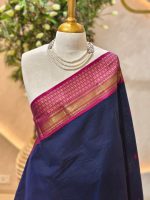Kanjee cotton with minimal buttas allover the body and contrast peacock motif woven border