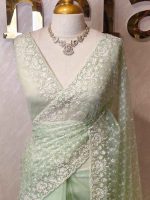 Organza with floral jaal design all over the body and heavy embroidered scalloped border - Image 4