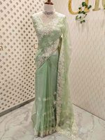 Organza with heavy embroidered and sequins cutwork border and minimal floral buti motif all over the body - Image 3