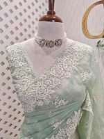 Organza with heavy embroidered and sequins cutwork border and minimal floral buti motif all over the body - Image 2