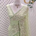 Organza with heavy floral sequins embroidered border and buti motifs all over the body