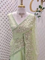 Organza with heavy floral sequins embroidered border and buti motifs all over the body