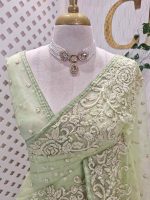 Organza with heavy floral sequins embroidered border and buti motifs all over the body - Image 2