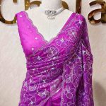 Organza with heavy tread embroidery all over the body and double scalloped border