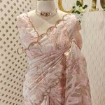 Organza with large leaf like pattern and scallop border