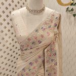 Semi-tussur with multicolour floral embroidered buttas all over the body and jali-cutwork border