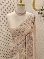 Semi-tussur with multicolour floral embroidered buttas all over the body and jali-cutwork border