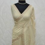 Tissue silk with jacquard inspired woven motif on the pallu and sequence,zari work scallop border