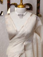 Tissue silk with thick floral applique embroidery on the pallu and minimal floral motifs allover the body. - Image 5