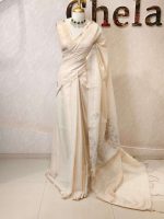 Tissue silk with thick floral applique embroidery on the pallu and minimal floral motifs allover the body. - Image 9