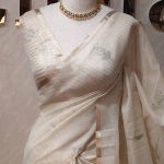 Tissue silk with floral,leaf like applique on the pallu