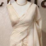 Tissue silk with leafy vein applique like embroidery on the pallu.